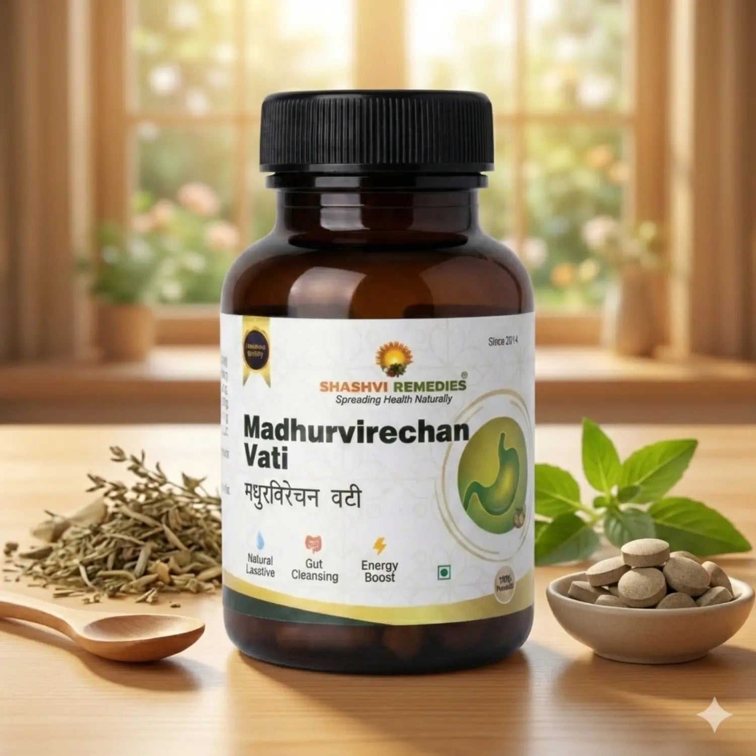 Bottle of Shashvi Remedies Madhurvirechan Vati on a wooden surface with herbs and a spoon in the background.
